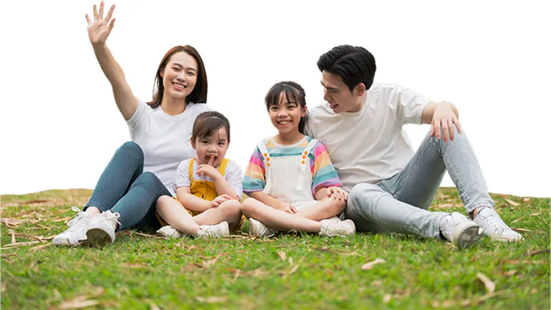 Family sitting on the grass for Cocolife LifeVest life insurance with investment linked Philippines