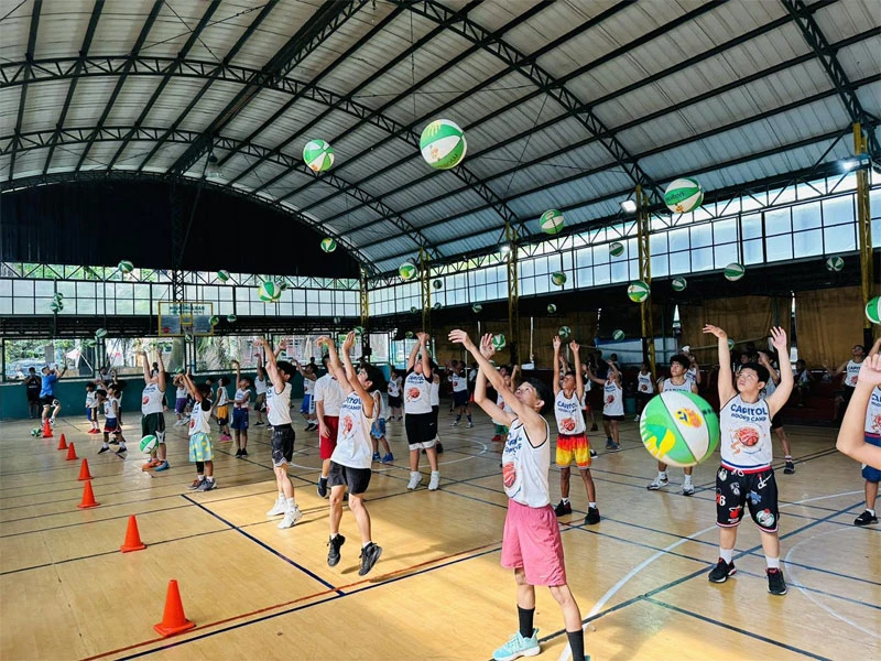 Cocolife's corporate social responsibility program in the Philippines with Filipino youth participating in a basketball